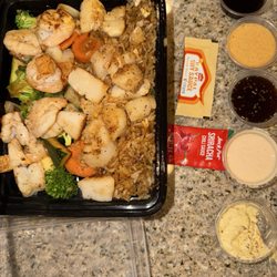 Shrimp and scallop with fried rice with an amazing sauce line up wow wow wow