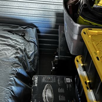 Lighter and Brighter - Storage is 10x25. This is after pulling about half of the stuff out of the unit. On the left is a car. - Home Organization Near Me
