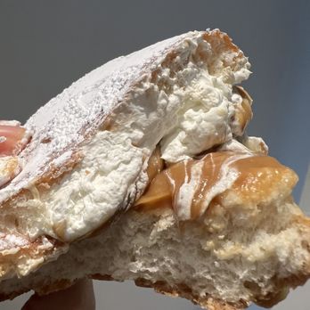 Machino Donuts - a hand holding a pastry - Donuts Near Me - Toronto, Ontario