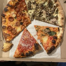 Assorted mushroom , tomato, basil - sausage and pepperoni pizza Assorted mushroom , tomato, basil - sausage and pepperoni pizza