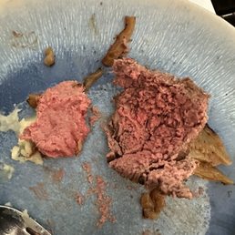 That part on the left is not chewed, that's how it fell out of the middle of the steak. That part on the left is not chewed, that's how it fell out of the middle of the steak.