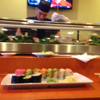 J & C House - Rainbow Roll and avocado roll with sushi chef and sushi bar in the background - Sushi Bars Near Me - Riverton, Utah