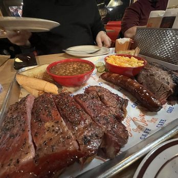 Swing Inn Cafe & BBQ - Combo Platter: 2 Smoked Meats: Pork Ribs and Brisket plus a Jalapeno Cheese Link. Sides: Texas Toast, Baked Beans and Mac-n-Cheese - Breakfast & Brunch Near Me - Temecula, California Swing Inn Cafe & BBQ - Combo Platter: 2 Smoked Meats: Pork Ribs and Brisket plus a Jalapeno Cheese Link. Sides: Texas Toast, Baked Beans and Mac-n-Cheese - Breakfast & Brunch Near Me - Temecula, California