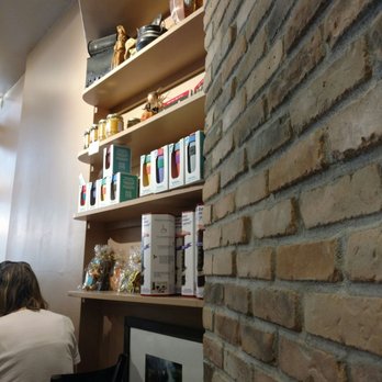 Coffee Tree Roastery - a woman sitting at a table - Coffee Roasteries Near Me - Toronto, Ontario Coffee Tree Roastery - a woman sitting at a table - Coffee Roasteries Near Me - Toronto, Ontario