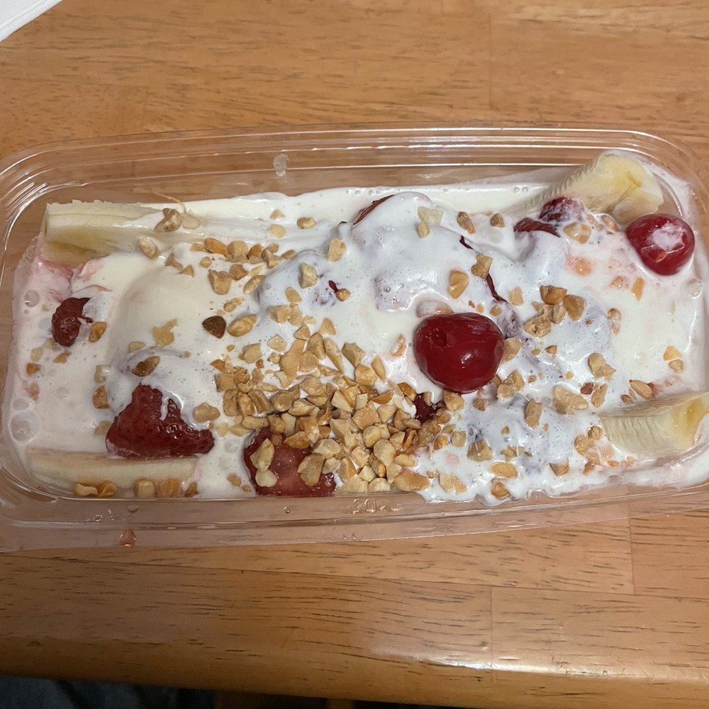Melted banana split. Almost no ice cream Melted banana split. Almost no ice cream