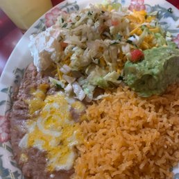 Beans, rice, guacamole, sour cream and lettuce cheese Beans, rice, guacamole, sour cream and lettuce cheese