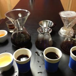 Cuvee Coffee - Cupping, or tasting, through three different techiques: Chemex, Melitta, and Clever (left to right).