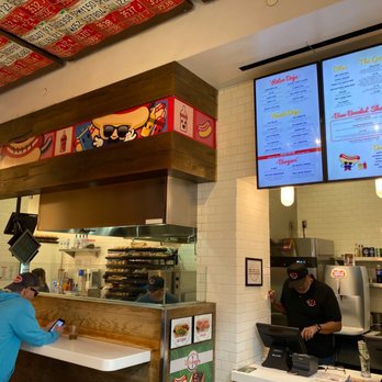 Haute Doggery - a man ordering food at a restaurant - Hot Dogs Near Me - Las Vegas, Nevada