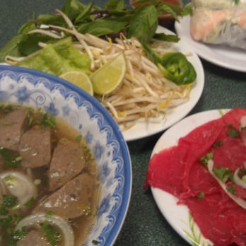 Saigon Deli - Beef noodle soup with meat balls and rare beef on the side, veggies for the soup, and spring rolls - Vietnamese Near Me - Tampa, Florida Saigon Deli - Beef noodle soup with meat balls and rare beef on the side, veggies for the soup, and spring rolls - Vietnamese Near Me - Tampa, Florida
