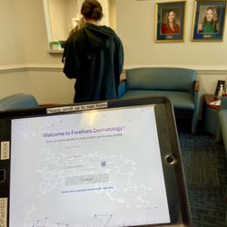 Forefront Dermatology - Check in with a tablet