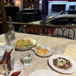 outdoor seating, caesar salad, beef tartare, triple-cooked fries outdoor seating, caesar salad, beef tartare, triple-cooked fries