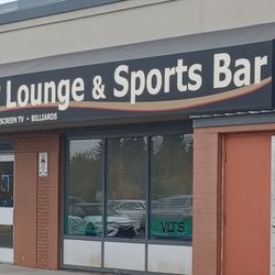 Bonnie's Lounge & Sports Bar - Entrance from parking lot .