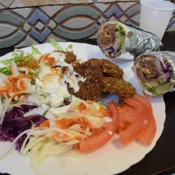 Specialità Pizza Il Kebabbaro - Falafel plate and a sliced kebab roll