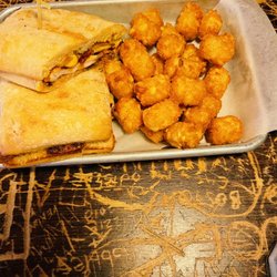 The Pretzel Bell - Chicken sandwich with tater tots