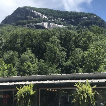 Chimney Rock Brewing - Outside with chimney rock behind - Breweries Near Me - Chimney Rock, North Carolina