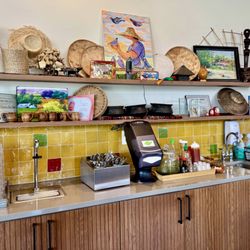 Hand washing, water, and condiment station.
