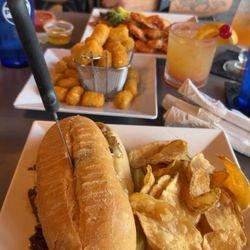The Landing Strip Tavern - Philly tots peel and eat shrimp and smoked old fashion