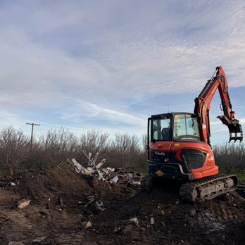 Demo Patrol - Kubota U-55 watching the sunset - Demolition Services Near Me