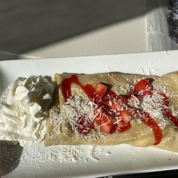 The Spot - Strawberry Shortcake Crepe with raspberry sauce, coconut flakes, and whipped cream. - Creperies Near Me - Cambria, California The Spot - Strawberry Shortcake Crepe with raspberry sauce, coconut flakes, and whipped cream. - Creperies Near Me - Cambria, California