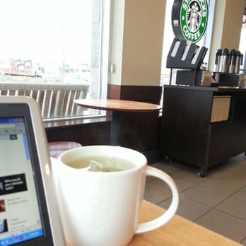 Starbucks - a cup of coffee and a laptop on a table - Coffee & Tea Near Me - Vaughan, Ontario Starbucks - a cup of coffee and a laptop on a table - Coffee & Tea Near Me - Vaughan, Ontario