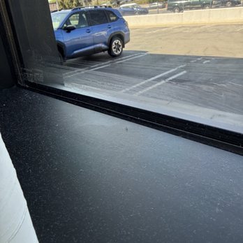 Fogo de Chão - Dust in the window sill next to my table after they supposedly cleaned it from the dead flies. - Steakhouses Near Me - Brea, California
