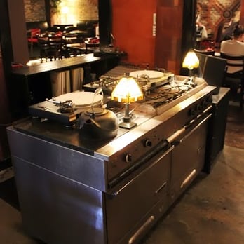The Mint - a restaurant kitchen with a large stove - Asian Fusion Near Me - Victoria, British Columbia