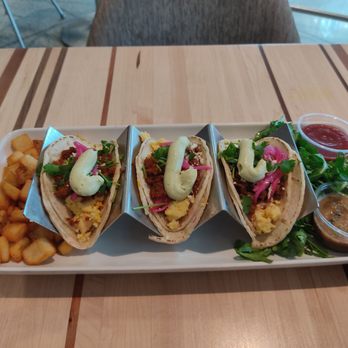 Root Down DIA - Breakfast tacos. That salsa has some heat to it - New American Near Me - Denver, Colorado