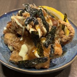 Miss Bāo - Karaage (Japanese Fried Chicken) Shoyu marinated, topped with teriyaki sauce, lemon aioli, nori and bonito flakes.