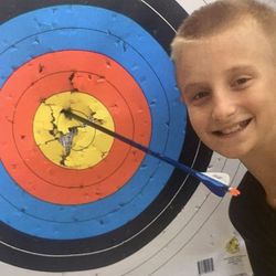 Runnymede School - Justin Marcarian doing some archery over a summer break