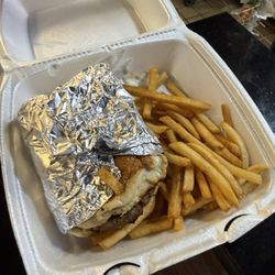 Trompo Taqueria & Burgers - Cheeseburger and fries takeout. The styrofoam container melted, making the food unsafe to eat.