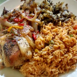 Africanne On Main Restaurant - Jolla rice and chicken with collards. Has a bit of kick!