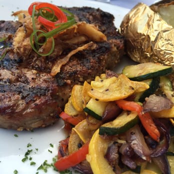 Virgil's At Cimmiyotti's - Their rib eye, cooked medium rare. Potato came with a side dish full of all the 'accessories' you'd expect. - Lounges Near Me - Pendleton, Oregon Virgil's At Cimmiyotti's - Their rib eye, cooked medium rare. Potato came with a side dish full of all the 'accessories' you'd expect. - Lounges Near Me - Pendleton, Oregon