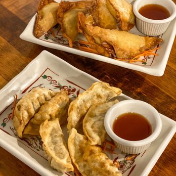 Sabaidee Thai Cuisine - Potstickers (front) and Wontons (back) both served with sweet & sour sauce. - Thai Near Me - Lehi, Utah