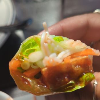 Soy House Vietnamese Cooking - a person holding a hot dog - Vietnamese Near Me - Bellingham, Washington