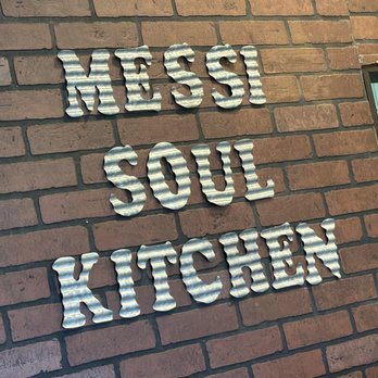 Messi Soul Kitchen - a sign on a brick wall - Soul Food Near Me - Riverside, California Messi Soul Kitchen - a sign on a brick wall - Soul Food Near Me - Riverside, California