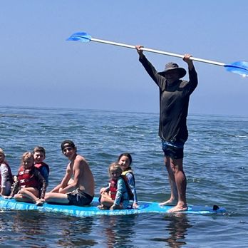 Beach Camp Laguna - Going out to see marine life on paddle board - Summer Camps Near Me Beach Camp Laguna - Going out to see marine life on paddle board - Summer Camps Near Me
