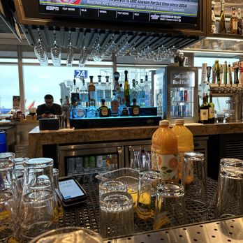 The District - At the bar - Airport Lounges Near Me - Oakland, California The District - At the bar - Airport Lounges Near Me - Oakland, California