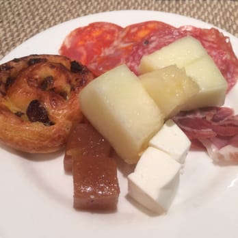 AC Hotel by Marriott Valencia - Breakfast Buffet - the brown cubes are Quince Jelly, while the white melon pieces are called "Santa Claus Melon" - Hotels Near Me - Valencia, V