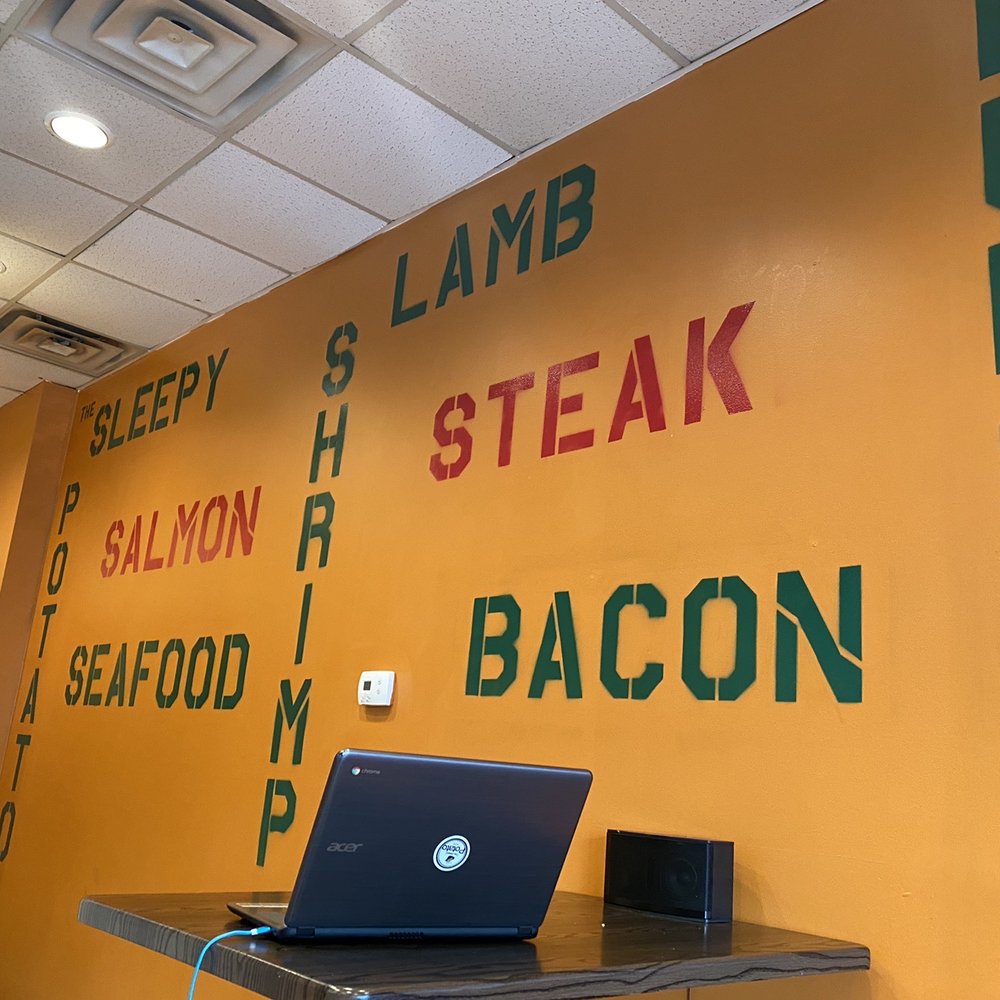 The Sleepy Potato - a laptop on a table - Chicken Shop Near Me - Atlanta, Georgia The Sleepy Potato - a laptop on a table - Chicken Shop Near Me - Atlanta, Georgia