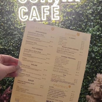 Comma Café - a hand holding a menu - Breakfast & Brunch Near Me - Hamilton, Ontario