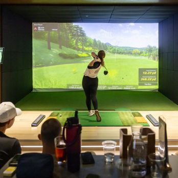 Golf VX - Friends enjoying a night out at Golf VX Arlington Heights. Indoor golf, great food, and good company all in one place. - Golf Near Me - Arlington Heights, Illinois