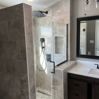 Hollerboys Construction - a bathroom with a walk in shower - Flooring Near Me Hollerboys Construction - a bathroom with a walk in shower - Flooring Near Me