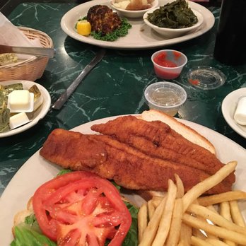 Southern Grill - We got the fried flounder sandwich and the broiled crab cake with greens and red potatoes. Yummmmm - Southern Near Me - Ellendale, Delaware