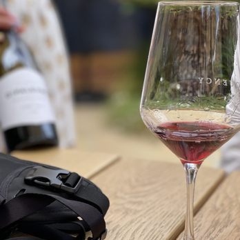Frequency Wine - a glass of wine on a table - Wine Tasting Room Near Me - Santa Barbara, California Frequency Wine - a glass of wine on a table - Wine Tasting Room Near Me - Santa Barbara, California