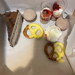 Kakes N Stuff - Chocolate mousse cake , chocolate macarons , cake shot glasses , cupcake and chocolate pretzels .