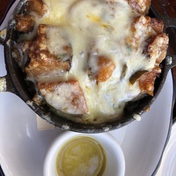 Park Tavern - Loaded Home Fries with hot sauce - New American Near Me - Delray Beach, Florida Park Tavern - Loaded Home Fries with hot sauce - New American Near Me - Delray Beach, Florida