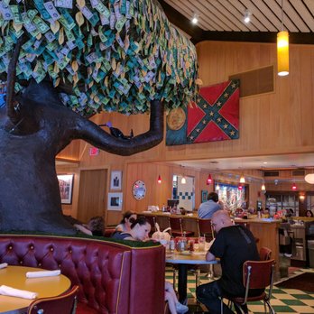 OK Cafe - The money tree with confederate flag symbol behind. Formerly part of the Georgia state flag. Just an anachronism. - Diners Near Me - Atlanta, Georgia