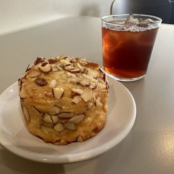 Ceremony Coffee Roasters - Harbor Point - Almond croissant with a black tea - Coffee & Tea Near Me - Baltimore, Maryland