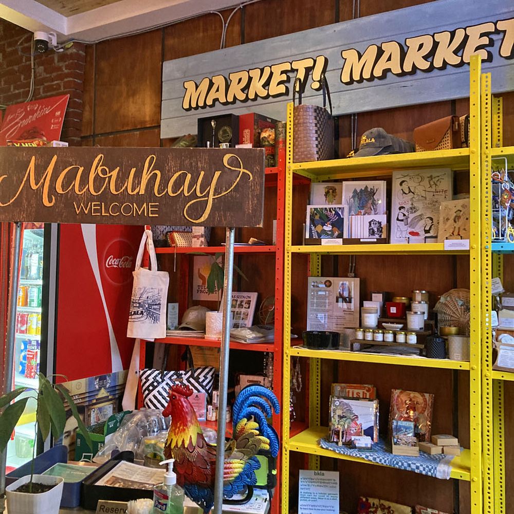Interior - welcome sign and the small market showcasing products by local Filipino artists and vendors Interior - welcome sign and the small market showcasing products by local Filipino artists and vendors
