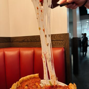 Giordano's - Cheesy pull - Pizza Near Me - Chicago, Illinois Giordano's - Cheesy pull - Pizza Near Me - Chicago, Illinois